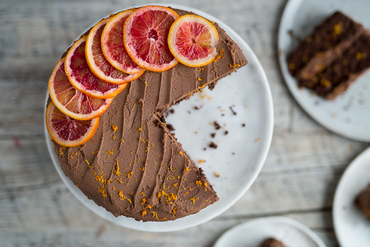 Double layer chocolate cardamom cake with spiced vanilla tea and a blood orange chocolate ganache all natural sugar gluten free dairy free